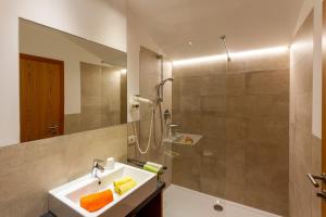 a bathroom with a sink and a shower at Appartments Moarhof in Vols am Schlern +37 photos