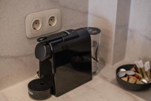 a microwave sitting on a counter next to a bowl of matches at Porto Searene in Nafplio
