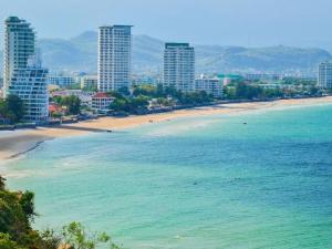 a view of a beach with buildings and the ocean at Jura 88 Guesthouse in Hua Hin