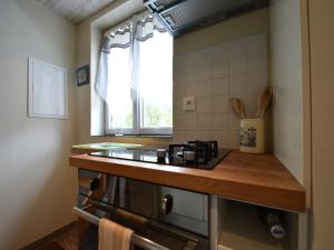 a kitchen with a counter top and a window at Holiday Home Saint-Gilles near Beach in Saint-Gilles-les-Bois