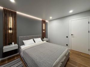 Postel nebo postele na pokoji v ubytování Апартаменти Скандинавський затишок