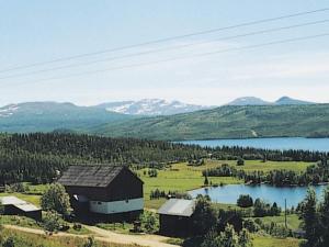 an aerial view of a barn and a lake at 6 person holiday home in Nordli-By Traum in Holand