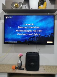 a flat screen tv sitting on a shelf at Mao condotel shore 3 residence in Manila +10 photos