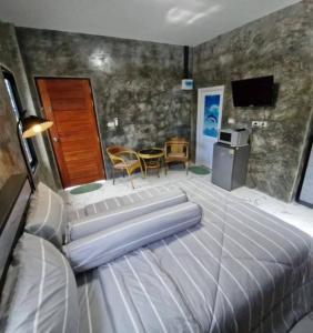 Postel nebo postele na pokoji v ubytování Baan Raweewan Resort + 11 fotografií