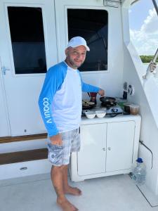 a man standing in the kitchen of a boat at Unit was sold in Caraballeda +15 photos