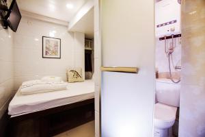 Letto o letti in una camera di Sun Guest House