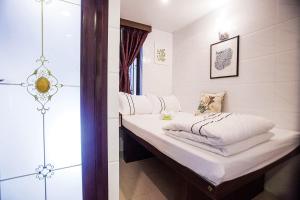 Voodi või voodid majutusasutuse Sun Guest House toas
