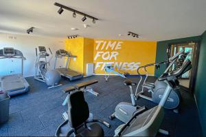 a gym with several exercise bikes in a room at Jen's Retreat in Lossiemouth