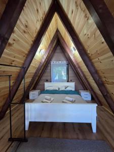 a bed in a room in a attic at Visitor Place in Plav