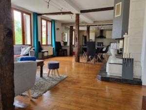 a living room with a couch and a table at Gite Ker Amance Dienville - 10 personnes in Dienville