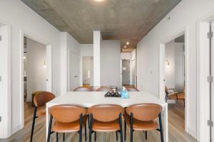 a dining room with a white table and chairs at Family-Sized 4BR Luxury in Downtown Chicago in Chicago +49 photos