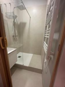 a shower with a glass door in a bathroom at T2 cosy Vieux Port de Marseille in Marseille +6 photos