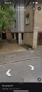 an image of a street with arrows pointing to a building at Superb Homestay in Cowlairs