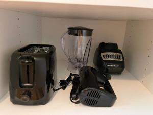 a kitchen counter with a blender and a toaster at Jai Hollow Tiny Home Cottage in Robbinsville