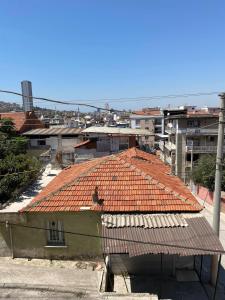 an overhead view of a building with a red roof at Star Apartment Derya Izmir in Konak