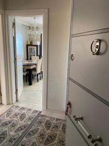 a door leading into a dining room with a table at Star Apartment Derya Izmir in Konak