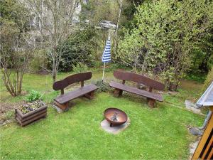 three park benches sitting in the grass with a flag at Mountain Hideaway in Wildenthal in Weitersglashütte +13 photos