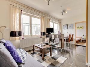 a living room with a couch and a table at Ferienwohnung in der Nähe von Skipisten in Winterberg +29 photos