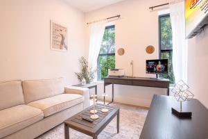 a living room with a couch and a table at Bright & Cozy 3Bd Brooklyn Getaway in Brooklyn