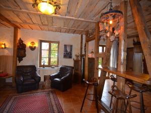 a living room with chairs and a bar in a house at WunderVilla in Hessen in Waldnähe in Vöhl +32 photos