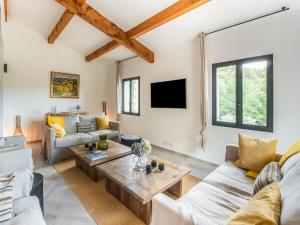a living room with couches and a table at Holiday Home in Vaison la Romaine with Pool in Vaison-la-Romaine +32 photos