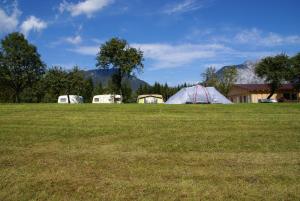 a group of tents in a field of grass at Alpen Natur Camp in Gröbming