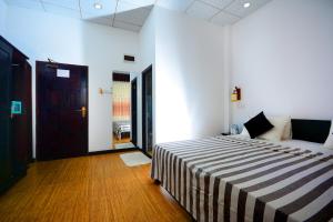 Ένα ή περισσότερα κρεβάτια σε δωμάτιο στο L&D Lodge