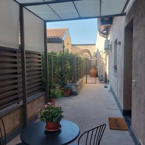 an empty courtyard with a table and chairs on a patio at Il Cortile in Pedara