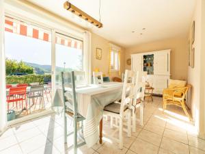 a kitchen and dining room with a table and chairs at Cosy villa in Montouliers with private pool in Montouliers