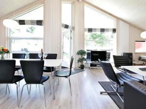 a dining room with a table and chairs at Holiday home in Großenbrode in Großenbrode