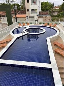 Kolam renang di atau dekat dengan Flat padrão, todo mobiliado 03
