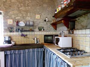 a kitchen with a sink and a stove top oven at Cottage in Casoli near Ski Slopes in Cocciglia +32 photos