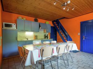 a kitchen with a table and chairs in a room at Nature Retreat in Waimes in Waimes