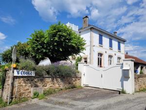 a white house with a gate in front of it at Holiday Home in Limousin near Forest in Sainte-Anne-Saint-Priest +32 photos