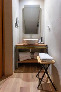 a bathroom with a sink and a mirror at LE RIVE Guest House La Ciosà in Chioggia