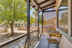a porch with a bench and a tree at 4 Mi to CSUSB Updated Home Near Shops and Eats in San Bernardino