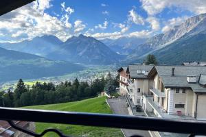 a view of a mountain range from a building at Albergo Ristorante Ginepro in Bormio