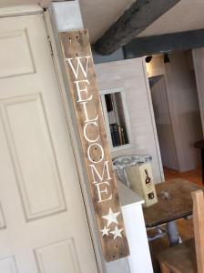 a door with a sign that reads winemaker at The Bear Inn in Llandovery