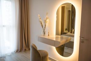 a bathroom with a sink and a mirror at Luxury Retreat 1BDR Apartment in Yas Island Premium Location with Pool and Gym in Yas Island