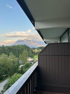 a balcony with a view of a mountain at Steinbock Apartement in Bad Goisern +28 photos