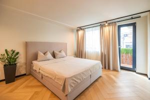 Ένα ή περισσότερα κρεβάτια σε δωμάτιο στο Origin Central Apartment