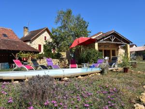 a group of chairs and a pool in a yard at Tranquil Escape in Dordogne in Saint-Avit-Rivière