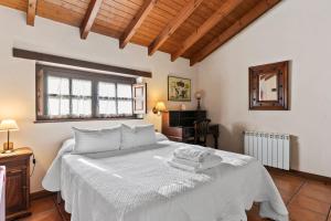 Ένα ή περισσότερα κρεβάτια σε δωμάτιο στο Valle de Bueida El Palacio