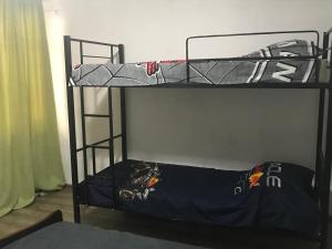a couple of bunk beds in a room at Casa Bonita in Tbilisi City