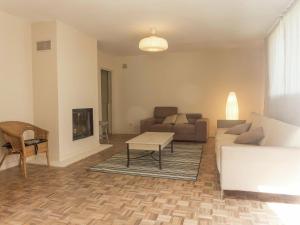a living room with a couch and a table at Holiday Home in Loupia with Private Pool in Loupia