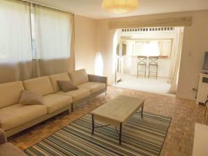 a living room with a couch and a coffee table at Holiday Home in Loupia with Private Pool in Loupia