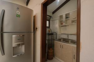 a kitchen with a stainless steel refrigerator and a sink at Sarao 2 in Santa Cruz de la Sierra