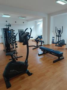 a gym with several exercise bikes in a room at Apartament Kryształowy - Kołobrzeg in Kołobrzeg +11 photos