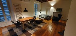 a living room with a table and chairs and a couch at Casa di Grazia in Intra