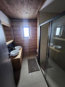 a bathroom with two sinks and a shower and two toilets at MoNa chalet in Pavčina Lehota +24 photos